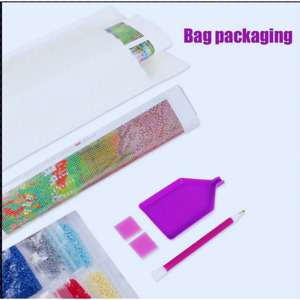 Packaging of a diamond painting kit with tools on a white background
